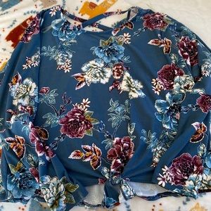 The color is blue and it’s a perfect shirt for the summer.